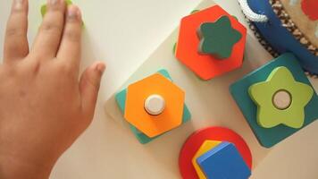 Kids exploring colorful shape blocks during playtime video