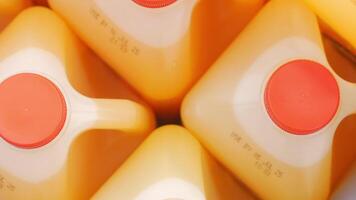 Fresh orange juice being prepared in large containers video