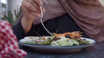 Delicious salad enjoyed in outdoor cafe setting video