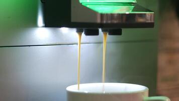 Making a fresh cup of coffee in a modern machine video
