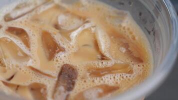 Enjoying iced coffee on a warm afternoon at a cafe video