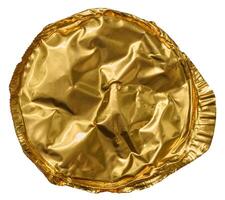 Wrinkled, round, golden foil lid, isolated background, viewed from above photo