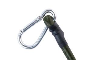 Close-up of a metal carabiner attached to a green elastic bungee cord on a white background. Durable tie down strap for automotive and outdoor use. photo