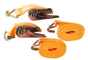 Top view of two coiled orange cargo straps and two ratchets with hooks, arranged on white background. Clean product layout for catalog or store listing. photo