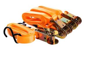 Side view of four orange cargo tie-down strap sets with hooks and ratchets, lined up neatly on white background. Ideal for promotional or e-commerce use. photo