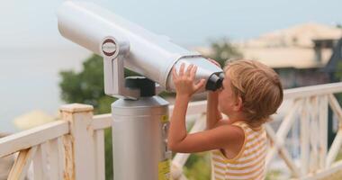 Child Exploring with Coin-Operated Binoculars at Scenic Overlook video
