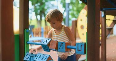 Child Playing with Educational Toy at Playground video