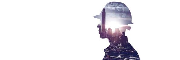 Double exposure construction worker with helmet and cityscape isolated on white background photo