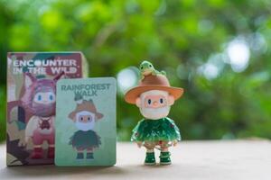 Bangkok, Thailand - June 2, 2025 Finding Unicorn FARMER BOB Encounter In The Wild Series Blind Box. The name is Rainforest Walk on table photo