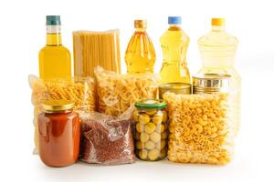 Foodstuffs in donation box isolated on white background with clipping path. photo