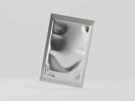 A silver foil packet sitting on a table photo