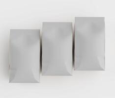 Three empty white bags on a white surface photo