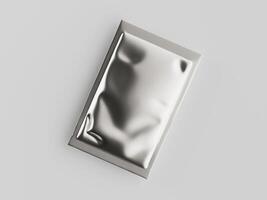 A silver foil packet on a white surface photo