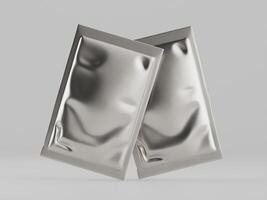 Two silver foil packets on a white background photo
