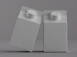 Two empty milk cartons on a gray background photo