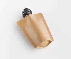 A brown paper bag with a black cap on top photo