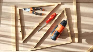 Building a wooden frame using tools in a well-lit workspace video