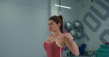 Girl athlete performs dynamic rotation exercise in training facility environment video