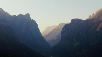 Aerial view of mountains near the town Dobbiaco and fog in Italian Dolomites video
