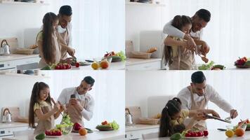In a well-lit kitchen, a father and daughter enjoy preparing food together. They chop vegetables and take photos of their delicious creations, showcasing a joyful bonding moment in their daily lives. video