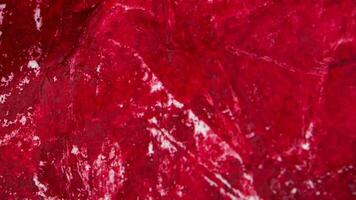 Crumpled paper stop motion animation, Textured red paper background. The concept of sketch pad, design, retro style, wrinkle, frayed, blank video