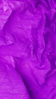 Purple crumpled paper stop motion animation, Textured paper vertical background. The concept of sketch pad, design, retro style, wrinkle, frayed, blank video