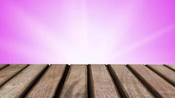 Empty wooden table with pink blur background and white shiny light looping for display video