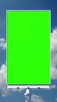 Portrait blank green billboard or large advertising display. Chroma key, time lapse, green screen, template, mock up and copy space concept promotion product ads video