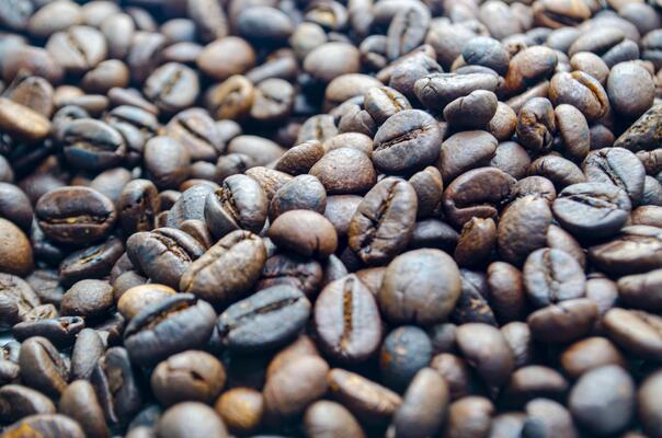 Top view of roasted coffee beans with customizable space for text