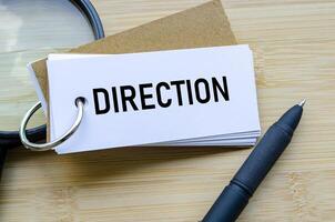 Direction text on notepad showing strategic movement and future planning photo