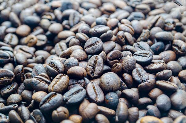 Roasted coffee beans that highlights the texture and surface details of the coffee beans with customizable space for text