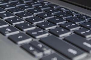 Laptop keyboard view symbolizing digital workspace and potential surface for cybersecurity risks. photo
