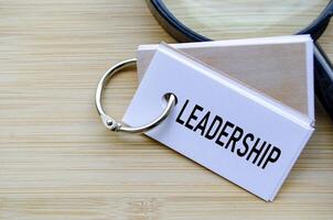 Leadership text on notepad highlighting the core of organizational direction and influence photo