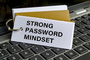 Strong password mindset note on keyboard advocating secure access practices photo