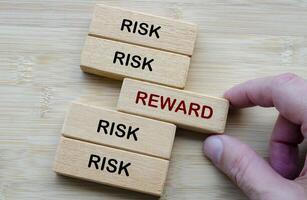 Risk and Reward text, depicting the classic decision making dilemma of weighing risk against reward in any venture photo