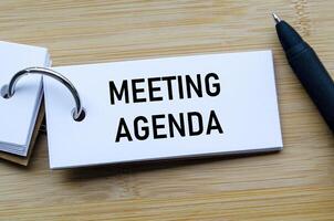 Meeting Agenda text on notepad illustrating structured planning and organized discussion points photo