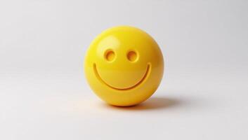 Bright yellow sphere with happy face symbol on white background photo
