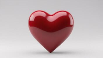 Glossy red heart shape on a simple grey background photo