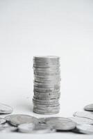 Stack of silver coins. rupiah on white background. photo