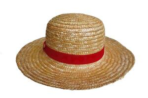 A straw hat with a red ribbon tied around it. The hat is sitting on a white background photo