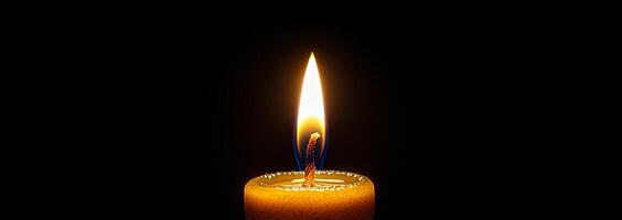 Candle flame illuminating dark space. A bright candle flame flickers in a dark setting, creating a serene and calming atmosphere. photo