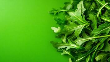 Fresh arugula for salad. Crisp arugula leaves are arranged on a vibrant green background, perfect for adding flavor to dishes. photo