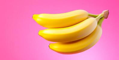 Yellow bananas on pink bg. Three ripe yellow bananas are arranged neatly against a vibrant pink backdrop, creating a bright and cheerful display. photo