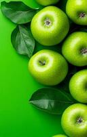 Green apples with fresh leaves. Fresh green apples sit atop a vibrant green background, surrounded by lush green leaves, creating a natural display. photo