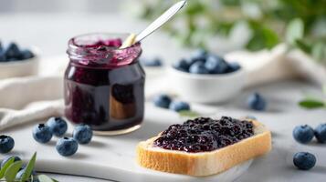 Blueberry jam on toast with spoon photo