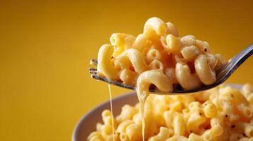 Macaroni and cheese with a spoon photo