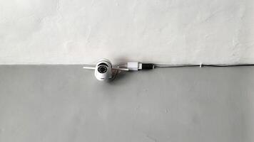 CCTV surveillance system on white and gray walls photo