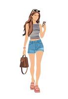 Stylish young woman walking and using smartphone vector