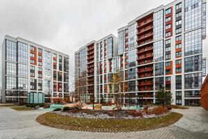 Architecture of a new residential quarter with a landscaped territory, view of a playground and building blocks. photo