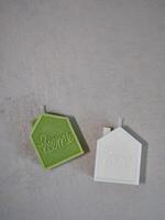 Two small candles with the word home on them photo